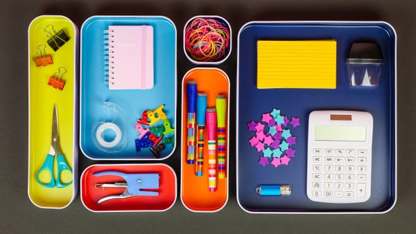 Office supplies in a desk organizer