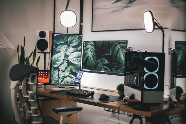 A monitor raised on a desk riser